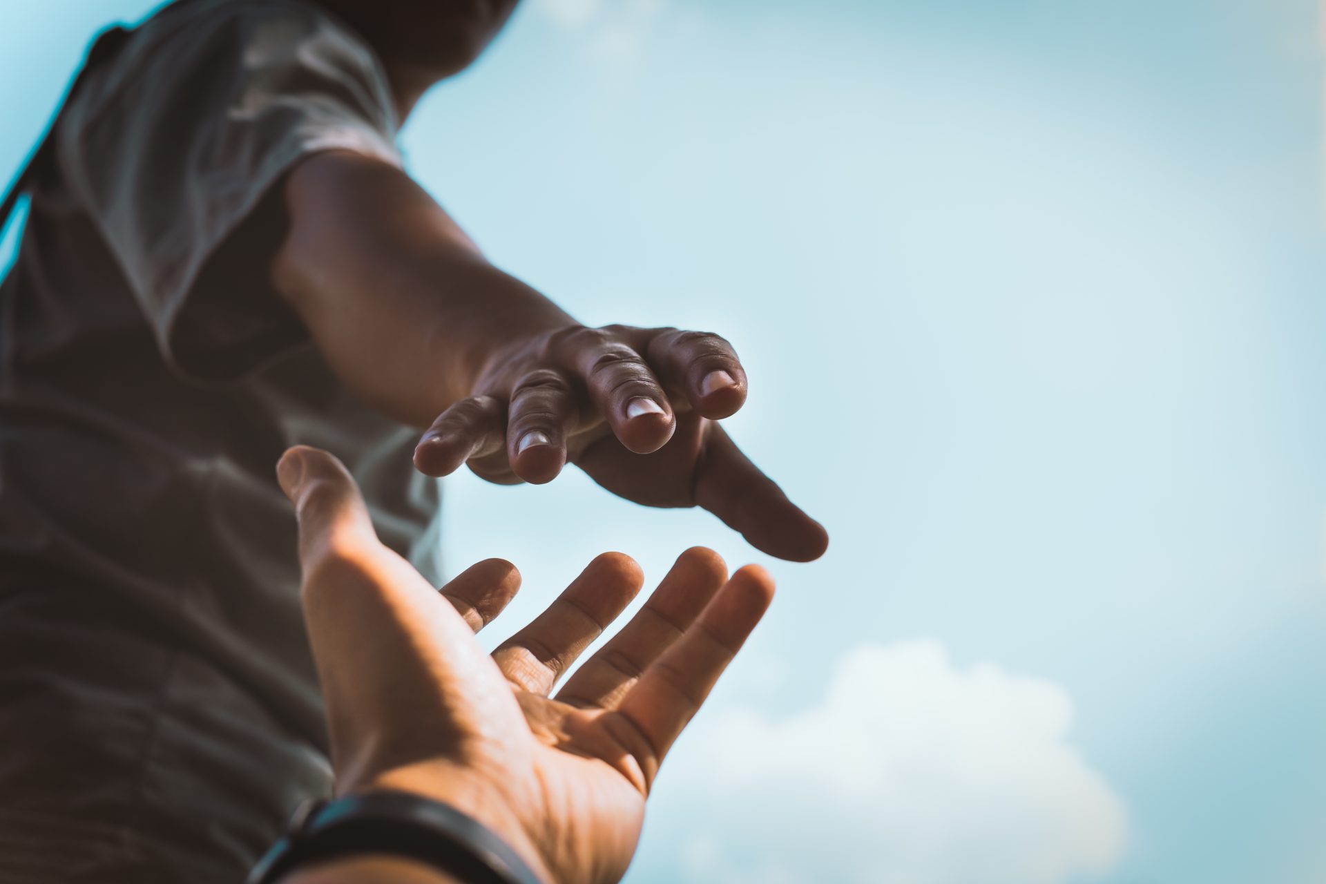 Help Concept hands reaching out to help each other in dark tone. about-us